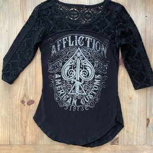 Black Affliction 3/4 sleeve top. Black & silver gems embedded in graphics.  XS.